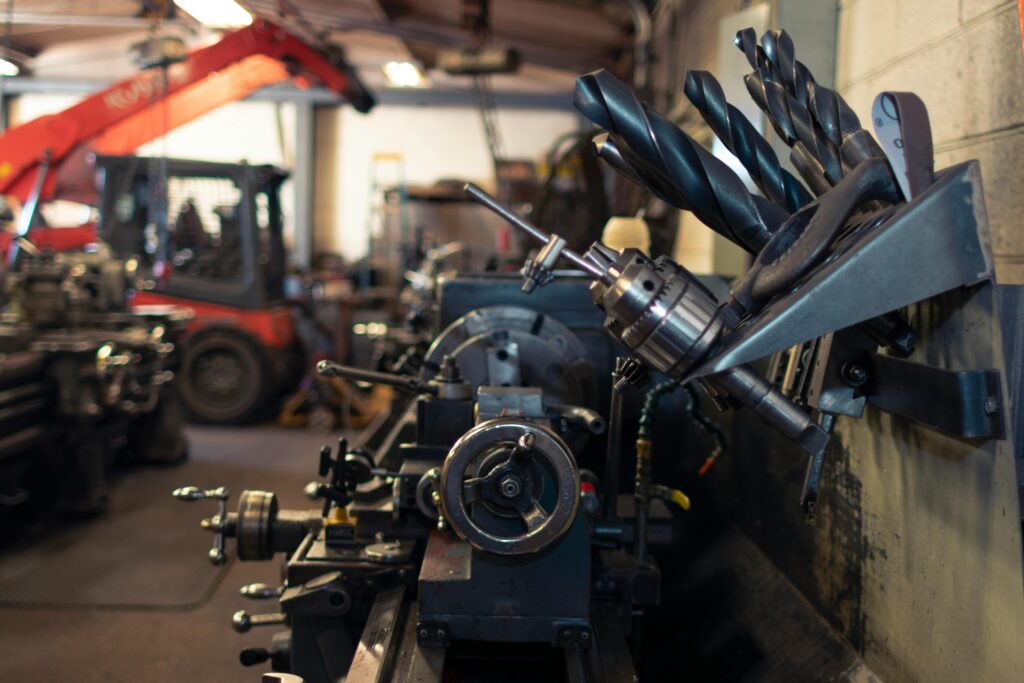 Close-up of a busy industrial workshop featuring machinery and tools.